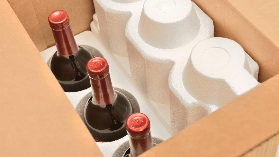 Wine packaged with cushioning material